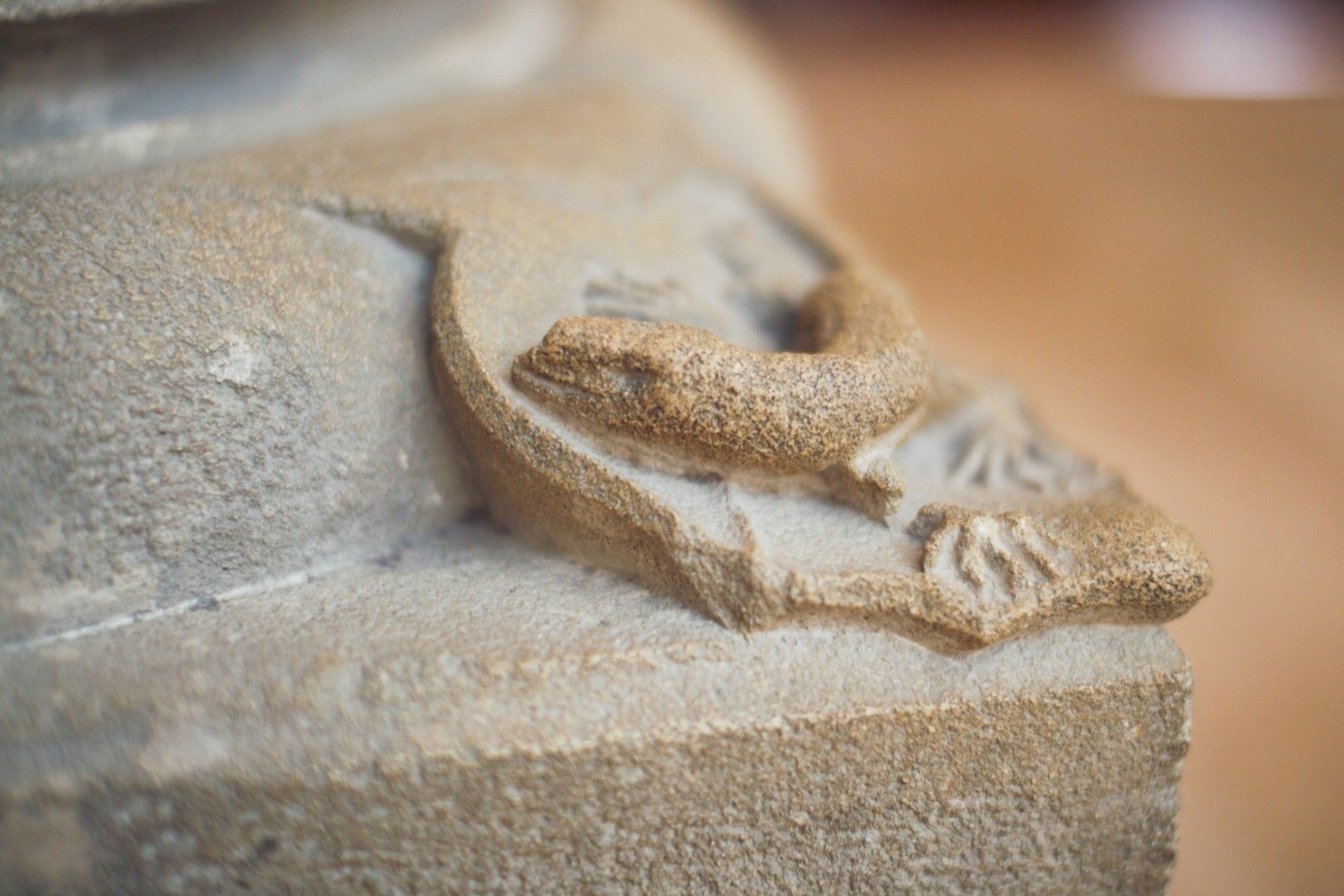 Romanesque lizard sculpture